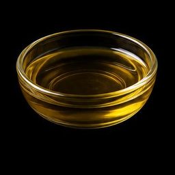Jojoba oil specimen photographed on a black background